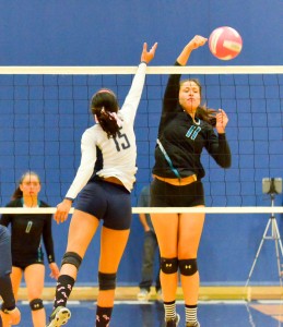 Kamehameha Maui's Kylee Yamashita (13) tries to block King Kekaulike's Brenalye Rodrigues (11) in four sets Friday. Photo by Rodney S. Yap.