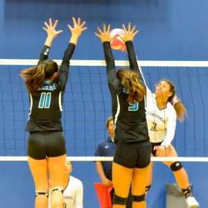 Kamehameha Maui's Selai Damuni (8) tries to hit inbetween the King Kekaulike block of Brenalye Rodrigues (11), K Kalena Vaivai (9). Photo by Rodney S. Yap.