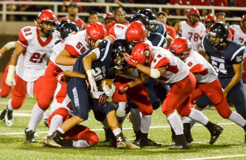 Kamehameha Maui running back Damon Martin find the going rough against Lahainaluna's interior defense. Photo by Rodney S. Yap.