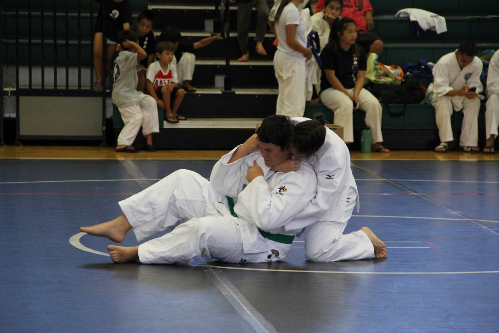 Nicole Ward of Hilo Hongwanji demonstrates a choke on Ethan Mayer of Hilo Hongwanji during the Kata Me No Kata competition. Photo credit: Cy Yoshizu