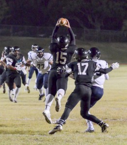 King Kekaulike's Antonio Savou (15) intercepts this Kamehameha Maui pass as teammate Larry Manalo (17) looks on. Photo by Rodney S. Yap.