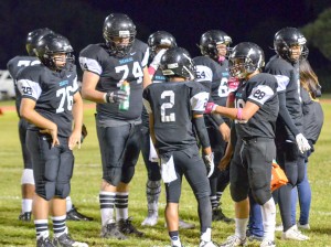 King Kekaulike's offense take a break during a second-half timeout Saturday. Photo by Rodney S. Yap.