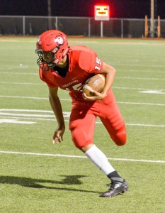 Lahainaluna sophomore Siale Hafoka returns this interception 29 yards to the Sabers 22-yard line. Photo by Rodney S. Yap.