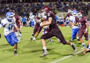 Baldwin's Taje Akaka (2) looks for running room as Maui High defenders are in hot pursuit. Photo by Rodney S. Yap.
