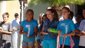 Kamali'i 5th graders learn hula moves at a ceremony for the garden they named at Four Seasons Resort Maui. Photo by Kiaora Bohlool.