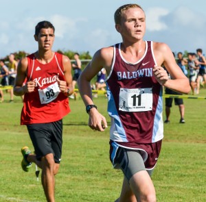 Baldwin and Kauai runners try to keep pace with the leaders through the first lap of the boys race Saturday at Seabury Hall. Photo by Rodney S. Yap.