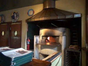 Maui's very first wood-burning oven still burns brightly today at Casanova. Photo by Kiaora Bohlool.
