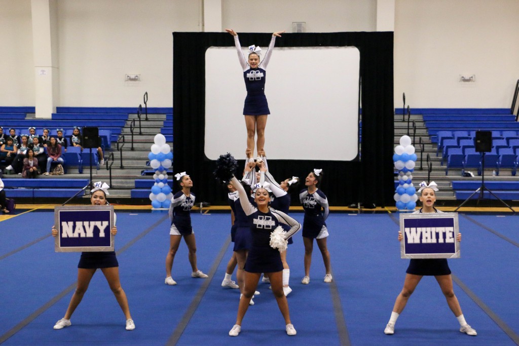 KSM JV encourages the audience to cheer “navy” and “white.”