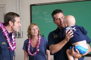 Trucker Dukes with Fire Chief Jeff Murray and his parents to the left. Dec. 14, 2015. Photo by Wendy Osher.