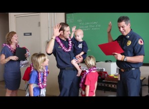 Trucker taking the oath of office as an honorary firefighter. Photo by Wendy Osher. Dec. 14, 2015.
