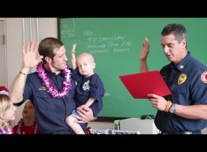 Trucker taking the oath of office as an honorary firefighter. Photo by Wendy Osher. Dec. 14, 2015.