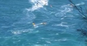 Massive sets rolling in at Peʻahi. Image shows one of multiple lost jet ski rescues. Image credit: Jack Dugan.