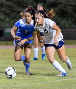 Baldwin's Kainoa Dafun and Kamehameha Maui's Ilihia Keawekane (right) battle for the ball Friday at War Memorial Stadium. Photo by Rodney S. Yap.