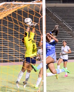 Baldwin's Skylar Littlefield hit this 40-yard free kick past the out-stretched hands of Kamehameha Maui goalkeeper Makamae Aquino Friday at War Memorial Stadium. Baldwin won 1-0. Photo by Rodney S. Yap.