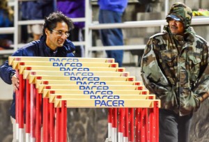 Kamehameha Maui's Leo Delatori and Nelton Waikiki help with the 300 hurdles Friday at the Kamehameha Maui Relays. Photo by Rodney S. Yap.
