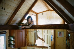 Island Tiny Homes, Viva Wittman on the steps Photo credit: Kailea Sonrisa, www.harnessyourbreath.com