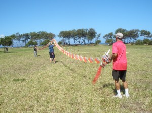 Robert Loera and volunteers setup a giant, 175-foot-long Chinese dragon kite for flight at Lahaina’s Kite Festival flying day. Photo courtesy of Lahaina Restoration Foundation