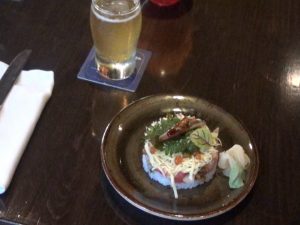 Bara Chirashi, a variety of seafood and seasonal vegetables sprinkled on sushi rice, served with Pau Hana Pilsner. Photo by Kiaora Bohlool.