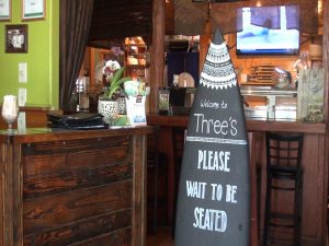 Surf-themed entry at Three's Bar & Grill. Photo by Kiaora Bohlool.
