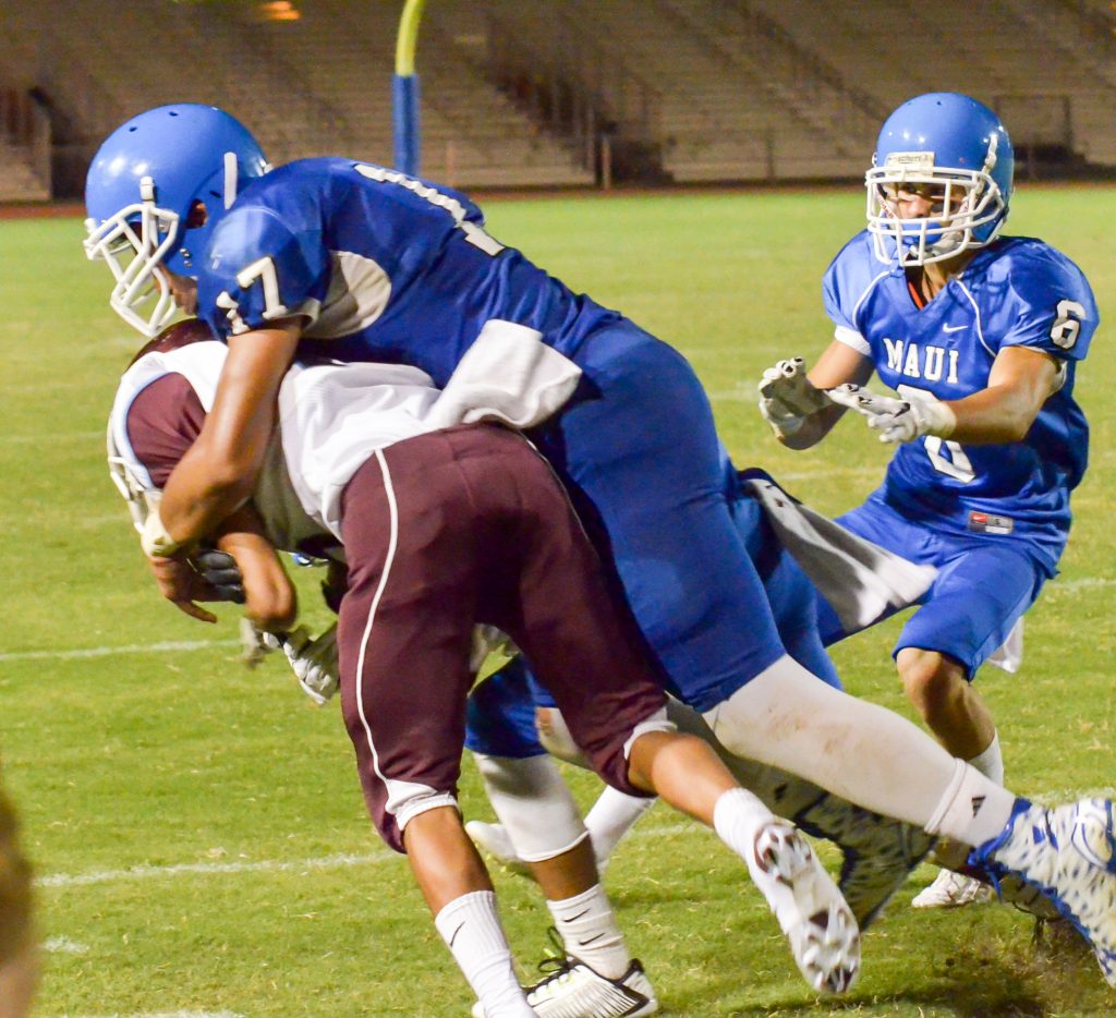 Maui High's Feleti Afemui makes a huge tackle behind the line of scrimmage against Baldwin last year. Photo by Rodney S. Yap.