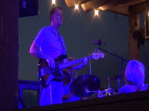Kona Storm plays in blue light at Fleetwood's on Front Street in Lahaina. Photo by Kiaora Bohlool.