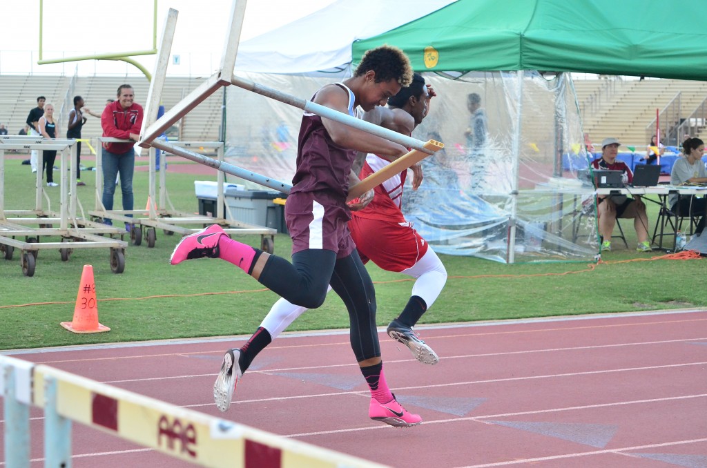 This 11-shot sequence by photographer Glen Pascual shows Baldwin High School's La'akea Kahoohanohano-Davis' attempt to push down the last hurdle in the 110-meter high hurdle race Saturday in the finals of the Victorino Ohana Invitational. But instead of going to the ground, the hurdle bounces back up and wraps itself around Kahoohanohano-Davis as he tries to finish the race. Photo by Glen Pascual.