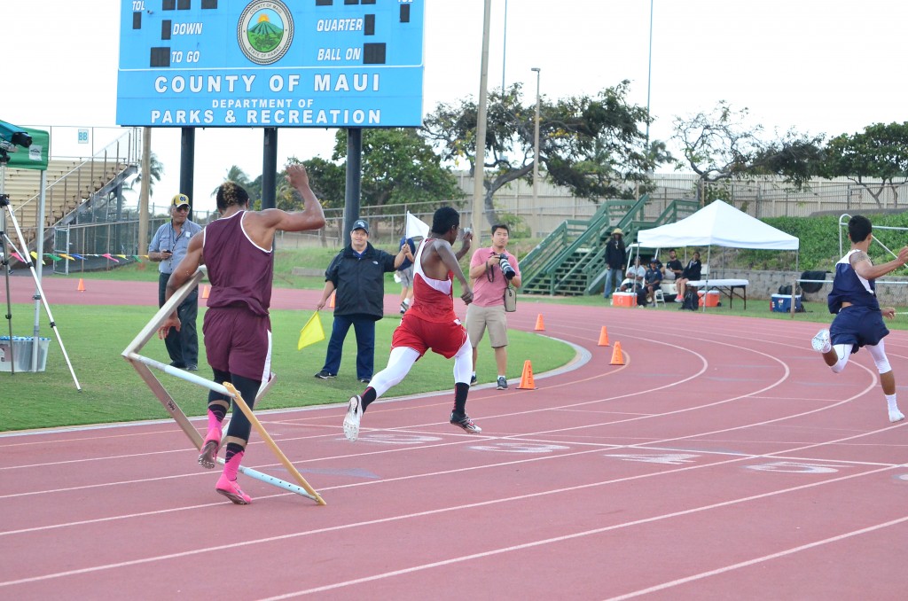 This 11-shot sequence by photographer Glen Pascual shows Baldwin High School's La'akea Kahoohanohano-Davis' attempt to push down the last hurdle in the 110-meter high hurdle race Saturday in the finals of the Victorino Ohana Invitational. But instead of going to the ground, the hurdle bounces back up and wraps itself around Kahoohanohano-Davis as he tries to finish the race. Photo by Glen Pascual.