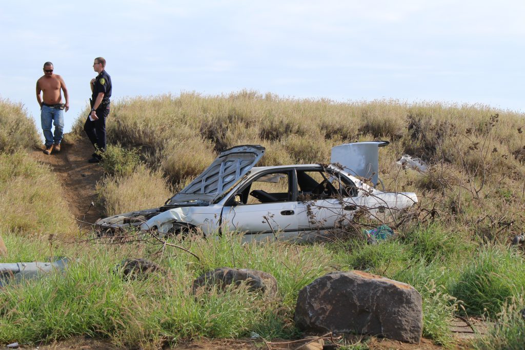Fire Burns Abandoned Vehicles in Vacant Kahului Field. (4.18.16) Photo by Wendy Osher.