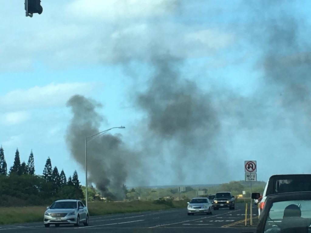 Fire Burns Abandoned Vehicles in Vacant Kahului Field. (4.18.16) Photo credit: Kaimana Nakamura.