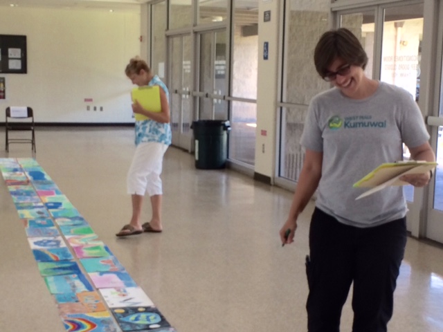Maui Water Department 2016 poster contest. Pictured here are judges Liz Foote (in the foreground) and Flo Bahr (in the background).