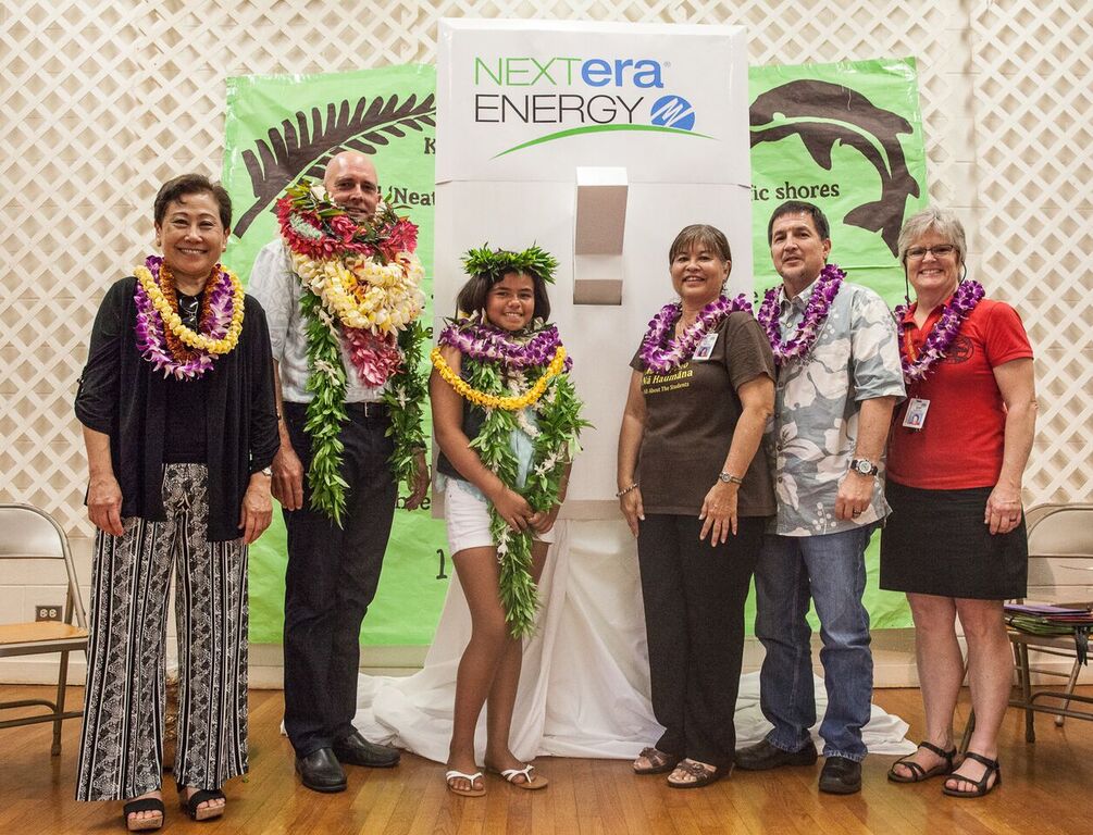 A celebration assembly was held Friday, April 8, at Kaunakakai Elementary to mark the completion of a hybrid solar air conditioning installation project. Sixth-grader and Student Council President Leonahemaikekaimalie Crivello was commended for helping the project become a reality. Photo credit: Kaipo Kiaha (Oiwi Television) via Hawaiʻi Department of Education.