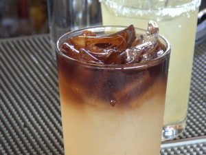 Cocktails at Manoli's Pizza Company, which offers two happy hours daily. Photo by Kiaora Bohlool.