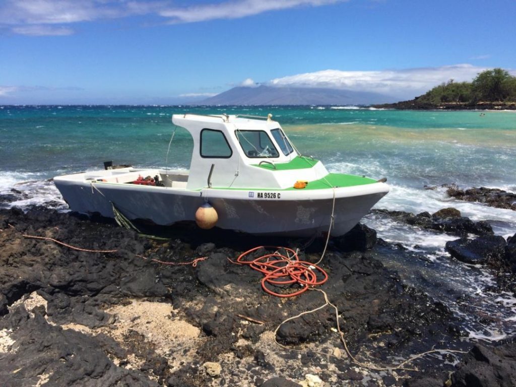 Grounded vessel at "Little Beach" in the South Maui area of Mākena. Photo credit: DLNR.