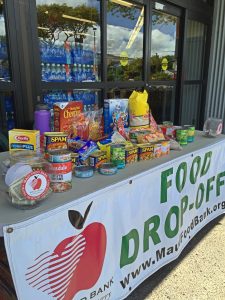 Donations fill a table at Lahaina Safeway. Courtesy photo.