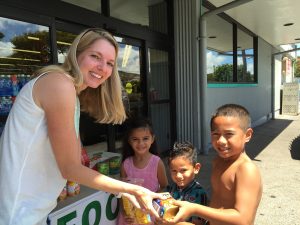 Melissa Crawley, representing the Rotary Club of Lahaina Sunset, accepts donations at the Lahaina Safeway from Nita Faleofa, Fono Faleofa and Paulo Galoia. Courtesy photo.