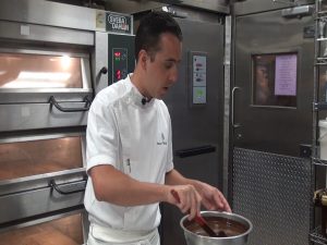 Four Seasons Resort Maui Executive Pastry Chef Bruce Trout tempers chocolate. Photo by Kiaora Bohlool.