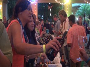 Wine makers pour glasses at Kapalua Wine & Food Festival. Photo by Kiaora Bohlool.