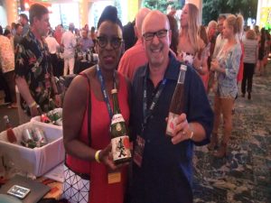 Kapalua Wine & Food Festival host Michael Jordan poses with a sake maker at the Seafood Festival. Photo by Kiaora Bohlool.
