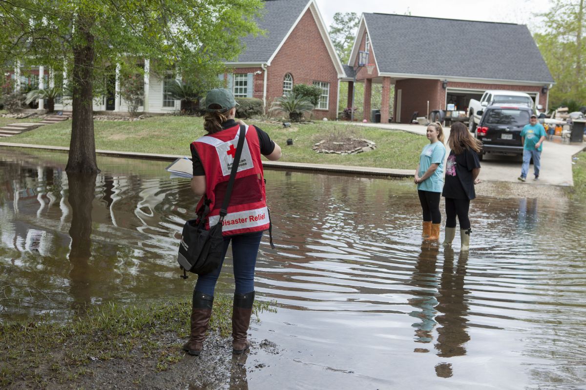 March 23, 2016. Deweyville, Texas. Theresa and Jenna Kroutter are seeing their Deweyville Texas home for the first time. Their home is on some of the highest ground in town, as it is built on a hill. Theresa said her neighbor called her to warn her that her house was beginning to flood. She said that "if your house goes under the entire town will be going under," Theresa said. "We will be back. We will be cleaning forever, but we will be back. We will be forever grateful to everyone that is here to help our town rebuild. People don't understand how bad it is here, it is worse than Katrina for us." Photo by Danuta Otfinowski/American Red Cross