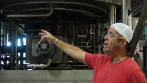 Tour guide Jeff Scritsmier shows a group around the brewery. Photo by Kiaora Bohlool.