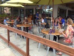 Outdoor seating at Fork & Salad, surrounded by a hand-crafted redwood railing. Courtesy photo.