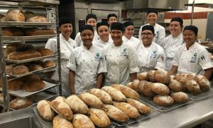 Baking students at UHMC and their freshly-baked bread. Courtesy photo.