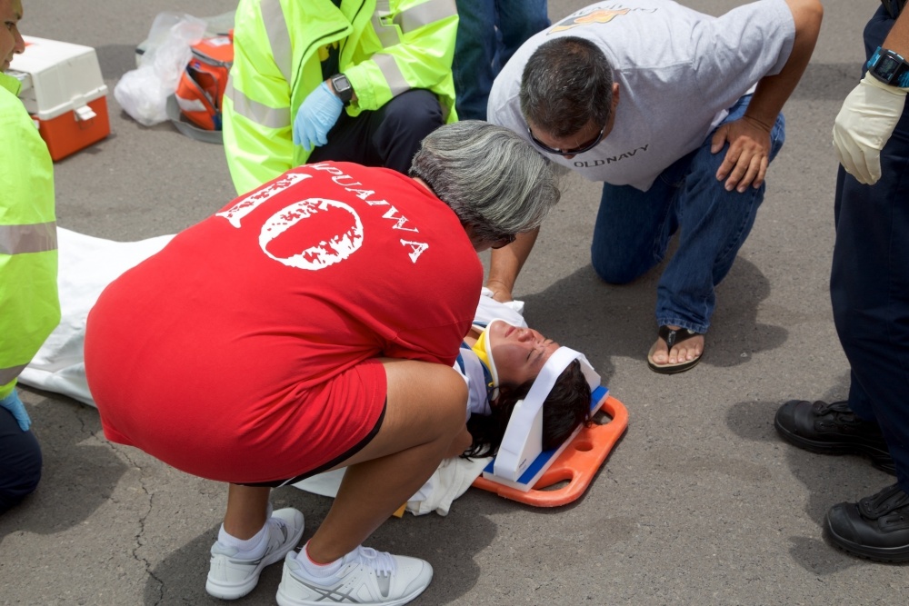 The mother of Sidney Uemoto checks on her daughter following her daughter's rescue nine miles off Kona, Hawaii, July 15, 2016. Uemoto and David McMahon were both rescued by a Coast Guard MH-65 Dolphin helicopter crew following an expansive joint search by Navy, Royal New Zealand air force, U.S. Air Force and Coast Guard crews. (U.S. Coast Guard photo by Lt. Cmdr. Kevin Cooper/Released)