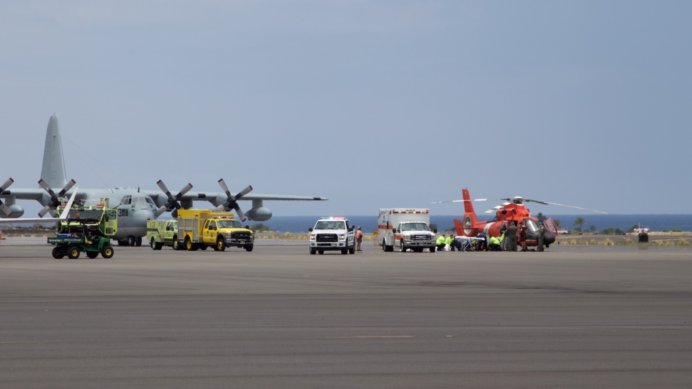 Coast Guard crews safely deliver David McMahon and Sidney Uemoto to emergency medical personnel in Kona, Hawaii, July 15, 2016, following their rescue nine miles off Kona. They were both rescued by a Coast Guard MH-65 Dolphin helicopter crew following an expansive joint search by Navy, Royal New Zealand air force, U.S. Air Force and Coast Guard crews. They reportedly sustained only minor injures in the crash. (U.S. Coast Guard photo by Lt. Cmdr. Kevin Cooper/Released)
