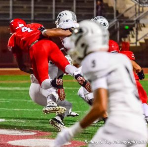 Lahainaluna's Onaloto Pahulu forces a fumble on this sack of Kapaa quarterback Kurt Napoleon Saturday. Photo by Rodney S. Yap.