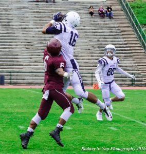 Kamehameha Kapalama's Chris Ah Mook Sang turns back and leaps for this reception against Baldwin's Joshua Yoruw (6). Photo by Rodney S. Yap.