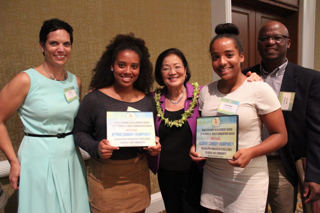 Senator Hirono and Daniel K. Inouye Innovation Award winners Keona (left) and Jasmine (right) Conroy-Humphrey from Lānaʻi High School, and their parents.