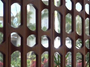 Carved wooden screens, symbolizing what sugar cane looks like under a microscope. Photo by Kiaora Bohlool.