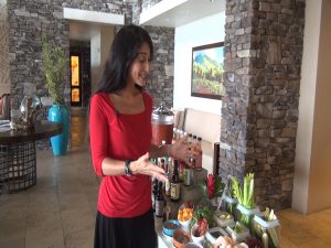 Maui Now's Kiaora Bohlool explains the build-your-own Bloody Mary bar at Cane & Canoe.