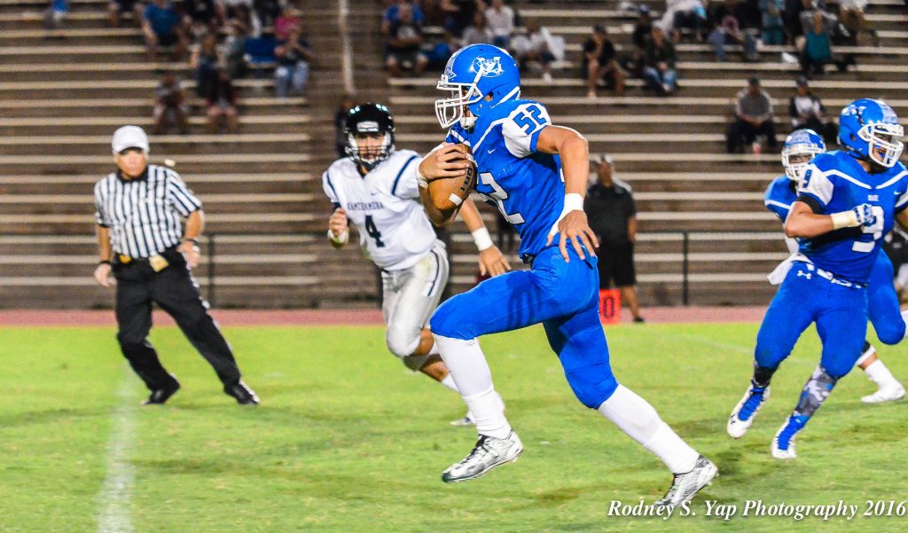 Maui High School's Jamie Elisara-Fisher (52) makes a break for the end zone after intercepting Kamehameha Maui quarterback Kainoa Sanchez (4). Photo by Rodney S. Yap.